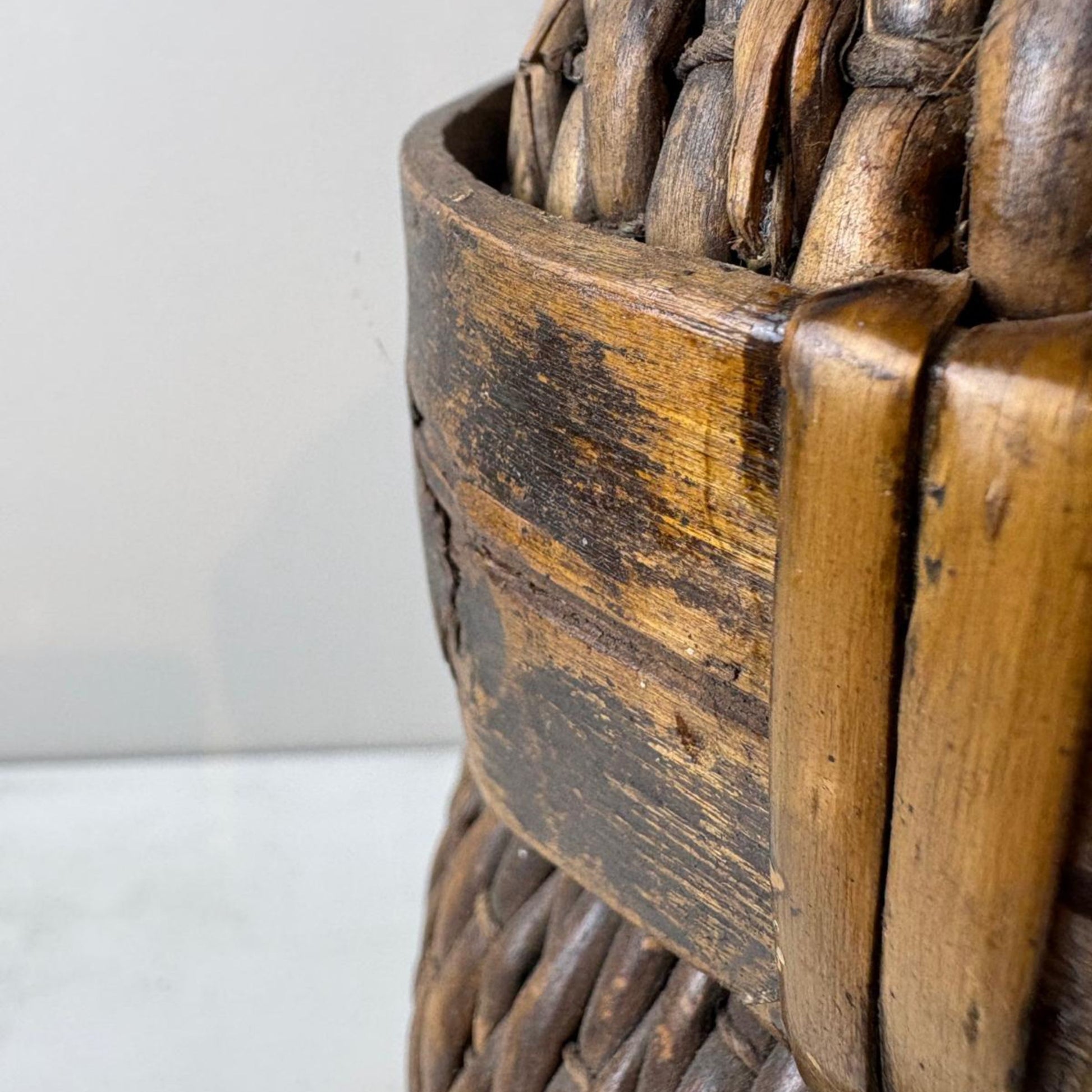 Close-up of a wicker basket with a textured surface on a light background