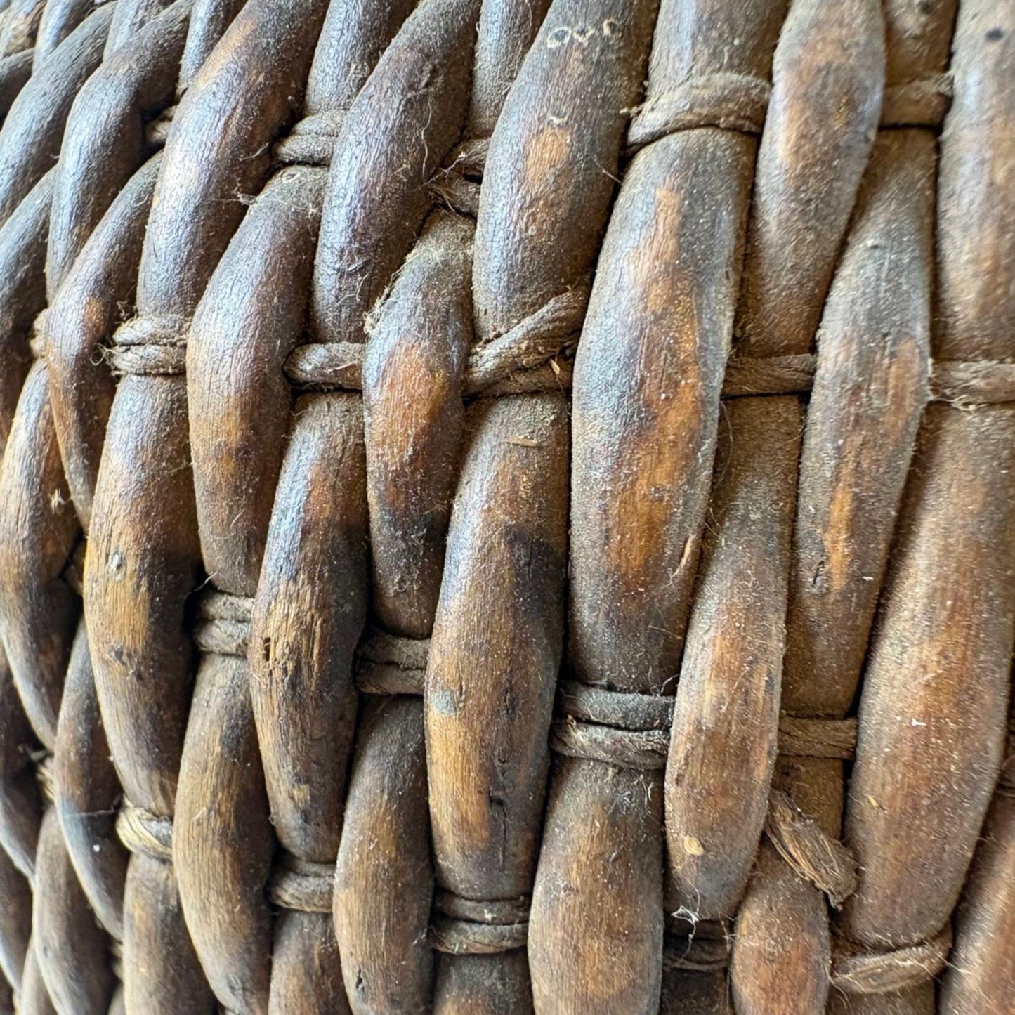 Close-up of a woven basket with brown and gray tones.